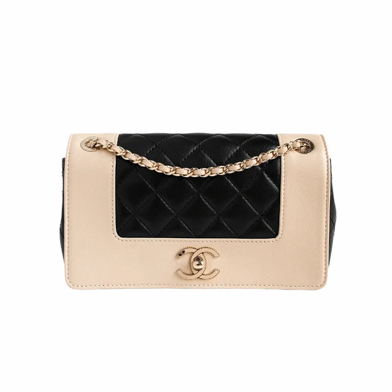 Chanel Quilted Leather Shoulder Bag for FashionistasMademoiselle Vintage Flap Bag in black and beige shiny sheepskin leather