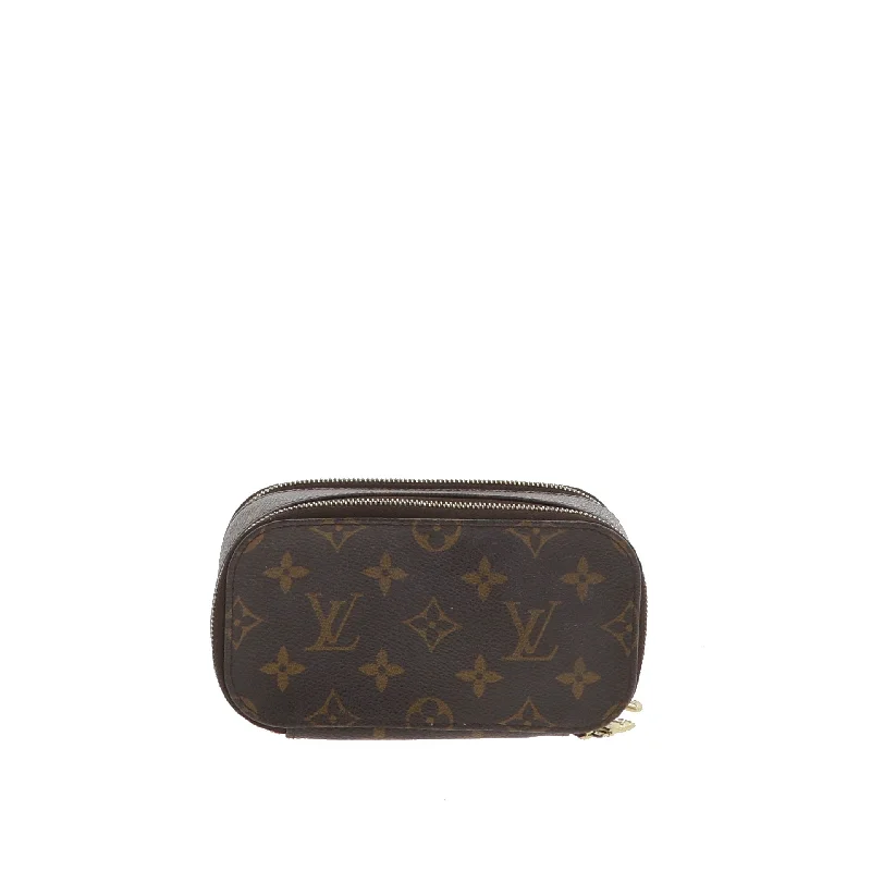 Louis Vuitton Twist bags with a contrast - colored interior for visual interestLOUIS VUITTON Travel Bag in Brown Canvas